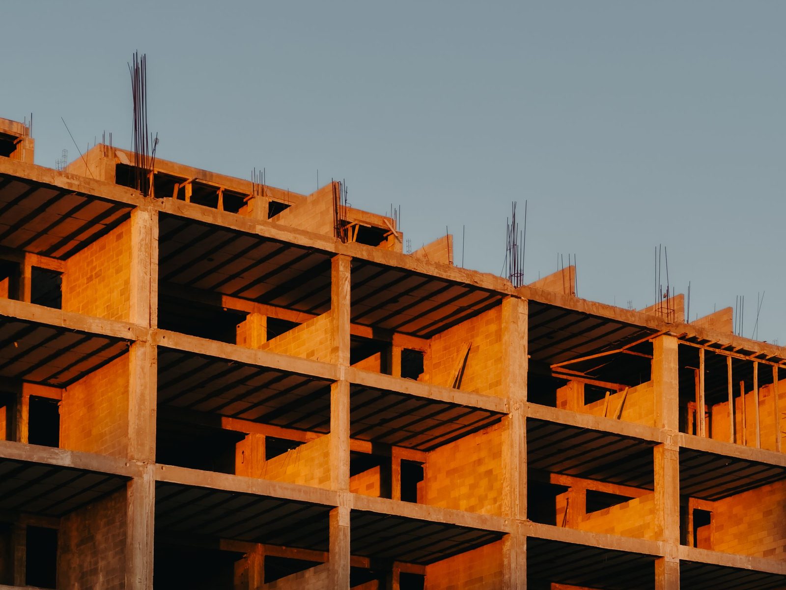 Concrete frame and brick infill of a multistory building under construction